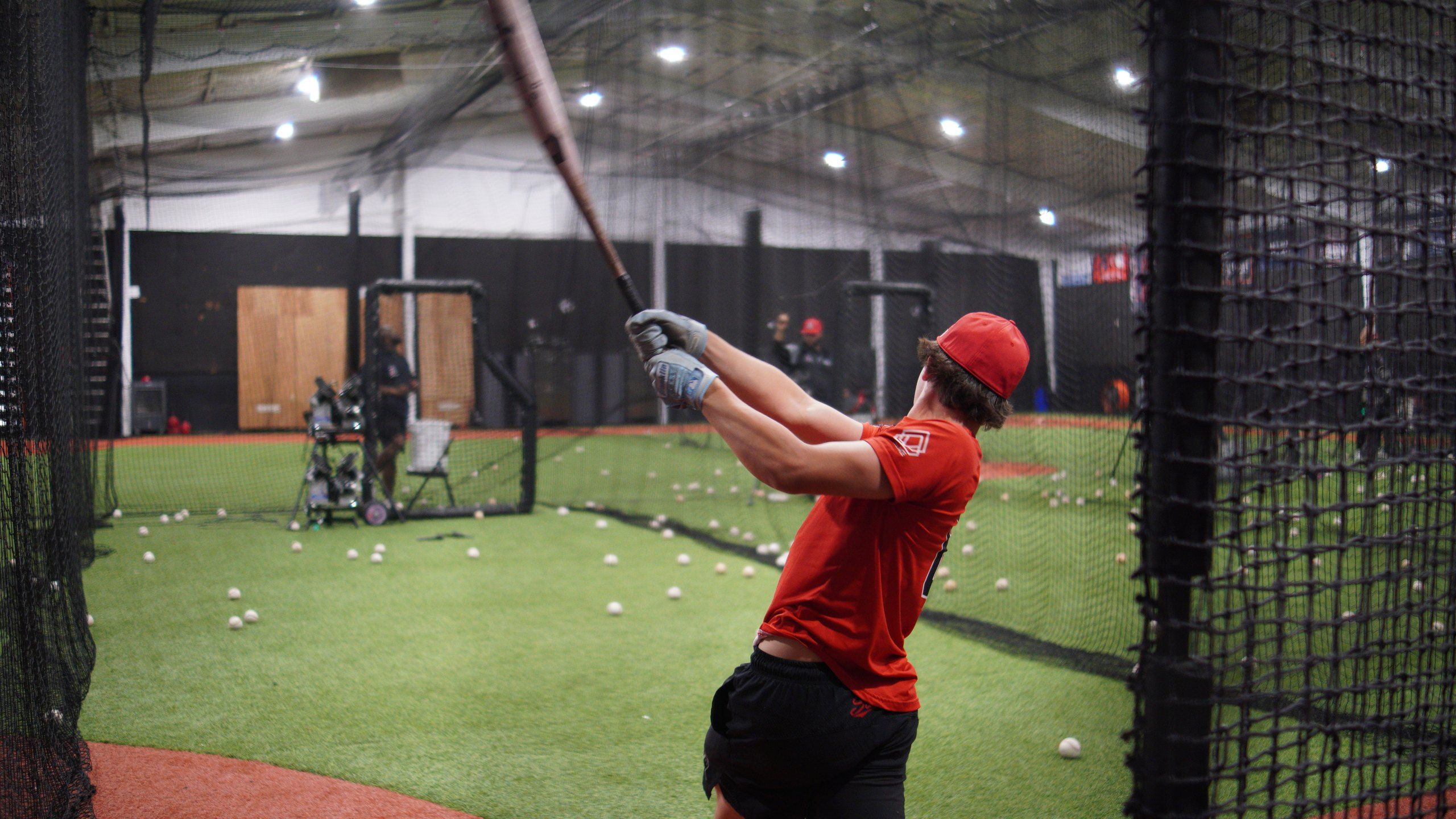An Admirals hitter finishes his swing in a batting cage at The ACE in Vacaville