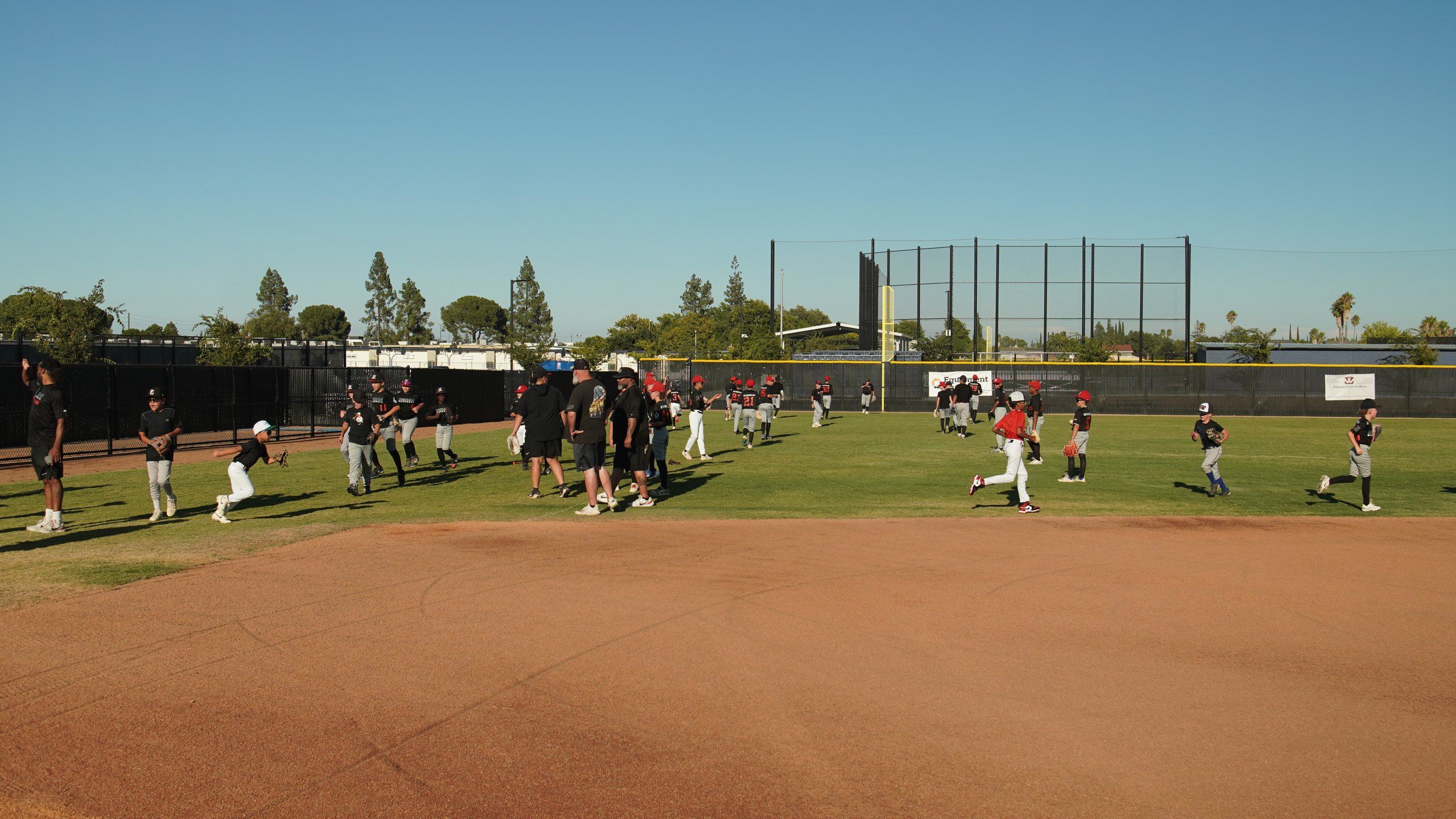 Admirals players work through infield and outfield drills at an outdoor field in Sacramento